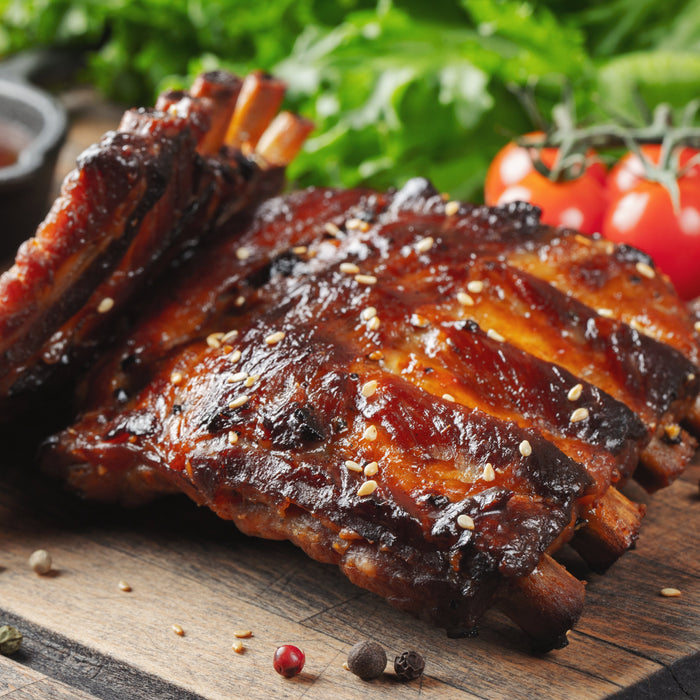 Delicious bbq ribs shown with barbecue sauce made using the Zoomgoods AF34 dual air fryer