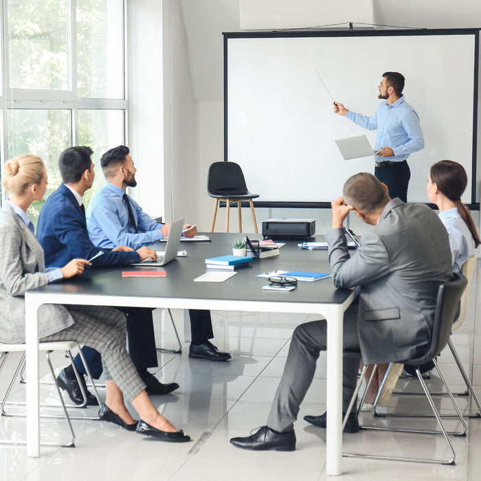 Tripod projector screen being used in a meeting room for a more engaging experience