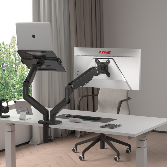 Zoomgoods Dual Monitor Stand desk-mounted arm holds a laptop on the left and a monitor on the right