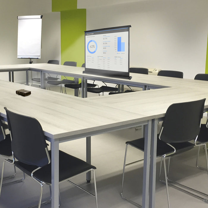 Zoomgoods DPS40/43 portable projector screen placed on office business desk for engaging interactions