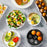 Zoomgoods EB35 BK electric egg boiler surrounded by meals created using it, including egg salad, avocado egg toast, protein bowl