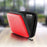 Zoomgoods HDC2 /RD red portable hard drive case with an external hard drive placed and strapped within