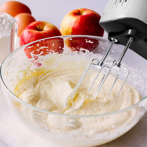 Zoomgoods HM4 SR hand mixer electric whisk mixing ingredients together in a bowl with apples in background