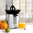 Zoomgoods JE6SR electric citrus juicer aesthetically shown on kitchen countertop with orange juice