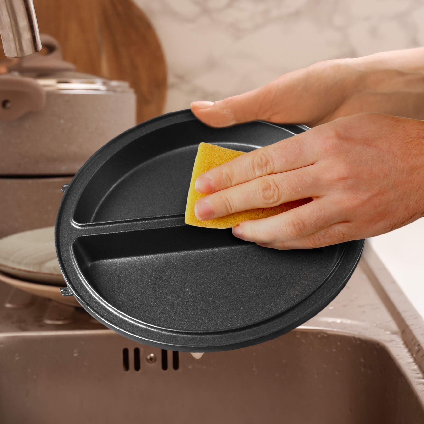 Zoomgoods OM60 electric omelette maker dual non-stick cooking plates being washed with sponge